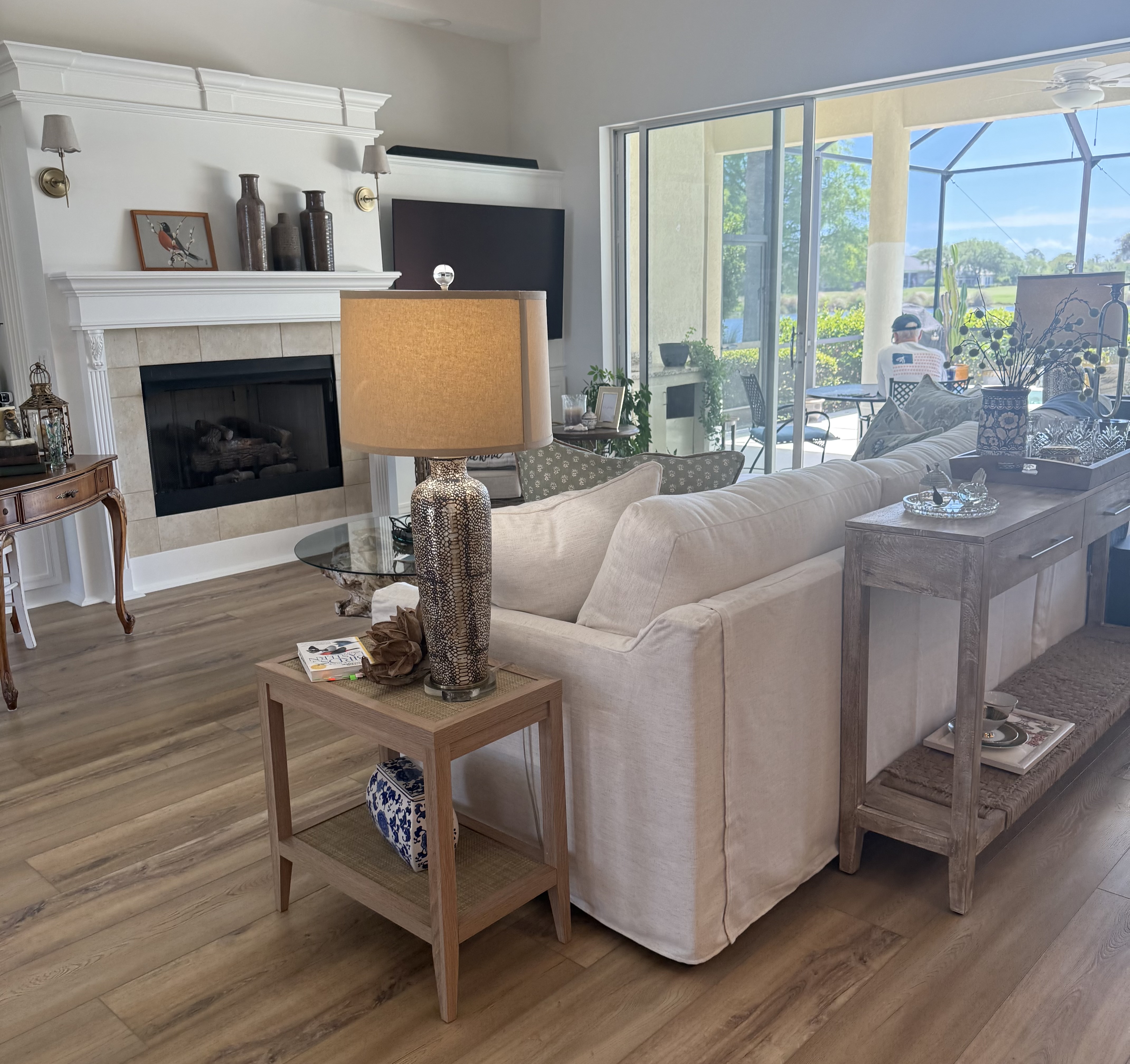 An elegant, COASTAL HOME — A blank canvas in the living room, dining room, and breakfast room, transformed into an elegant, coastal environment.